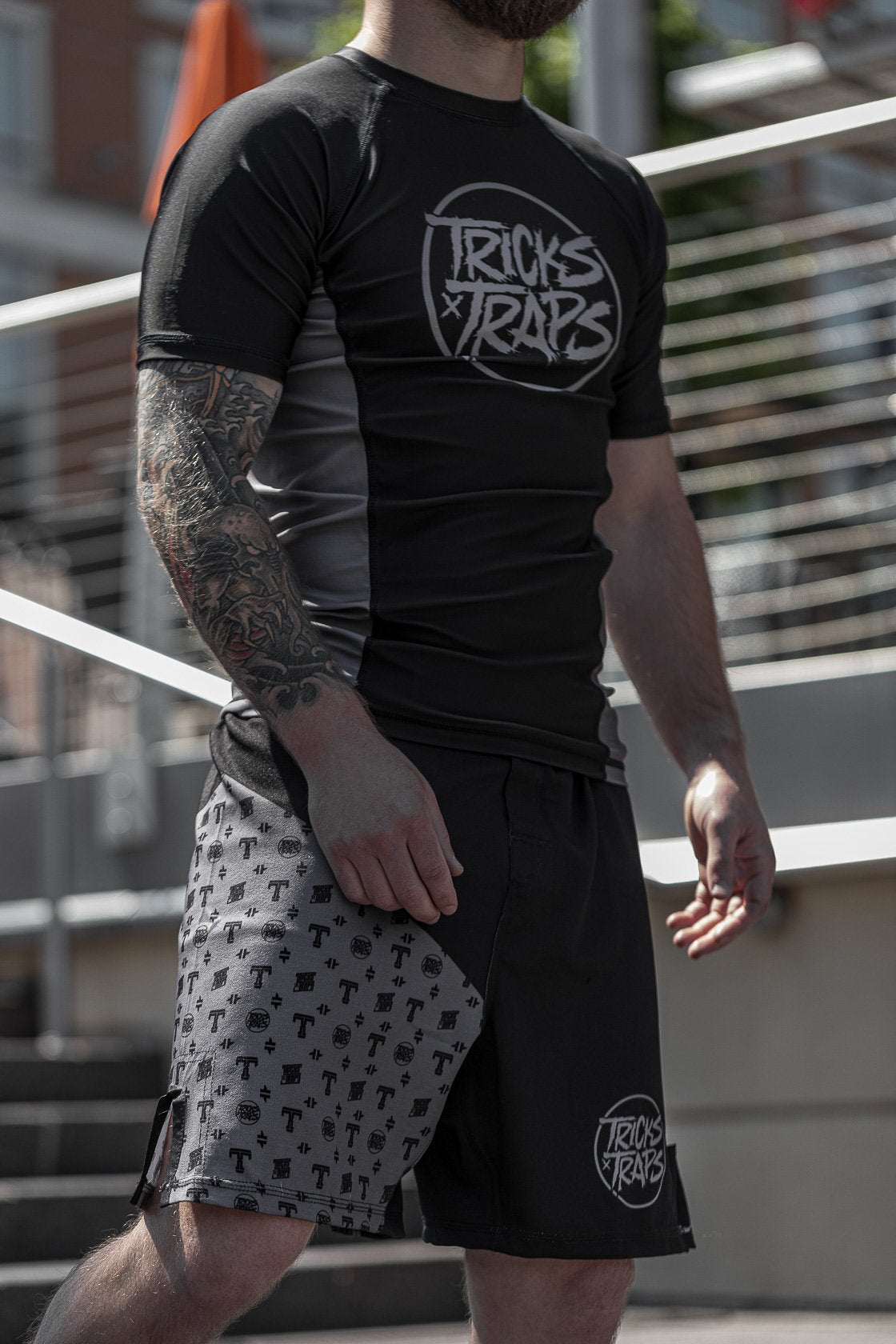Tricks and Traps Batch 1 No-Gi jiu jitsu set. Black and Silver short sleeve rash guard and jiu jitsu shorts.